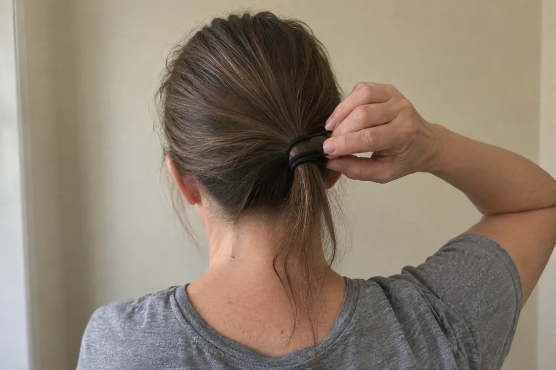 Thin ponytail with hair tie wrapped three times