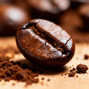 Close-up of a coffee bean with ground coffee around it