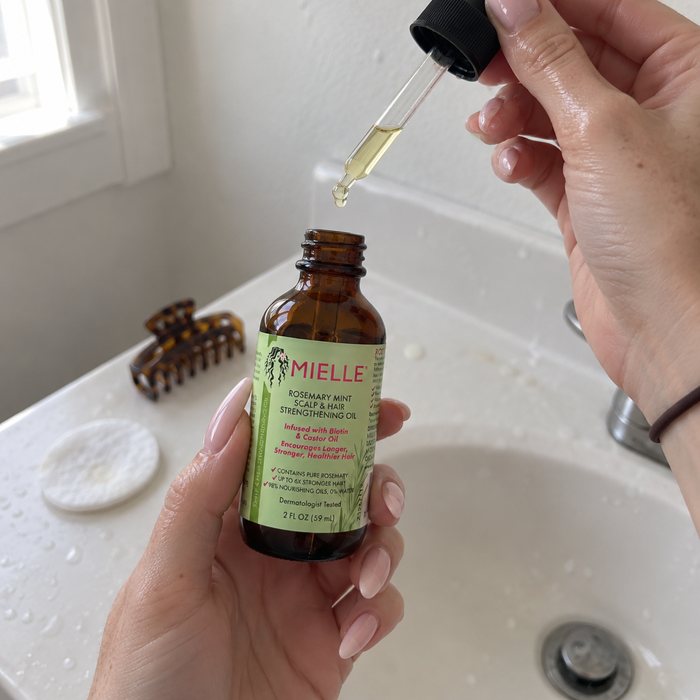 Rosemary oil dropper over the sink